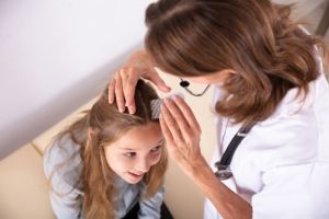 Doctor Examining Girl's